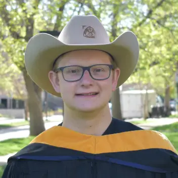 Nathan graduating with his M.S.